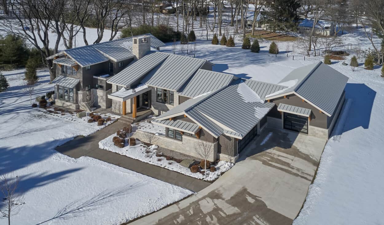This mountain inspired property in Michigan was designed to use natural materials, incorporate the home with the surrounding landsacape, and offer an open interior design for the family