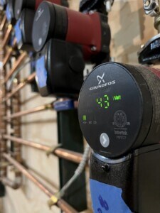 This mechanical room features a variety of powerful state-of-the-art solutions that provide reliable and functional heating, plumbing, internet, power, and more. These Grundfos pump systems allow water recirculation, heating, pressure boosting, and more in this residential system.